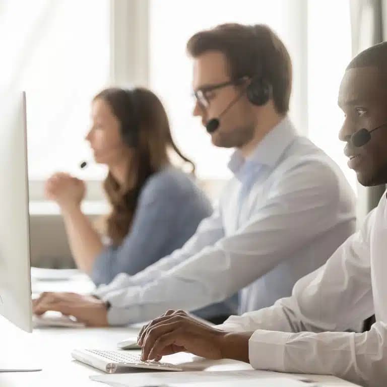 A sales team speaking with customers